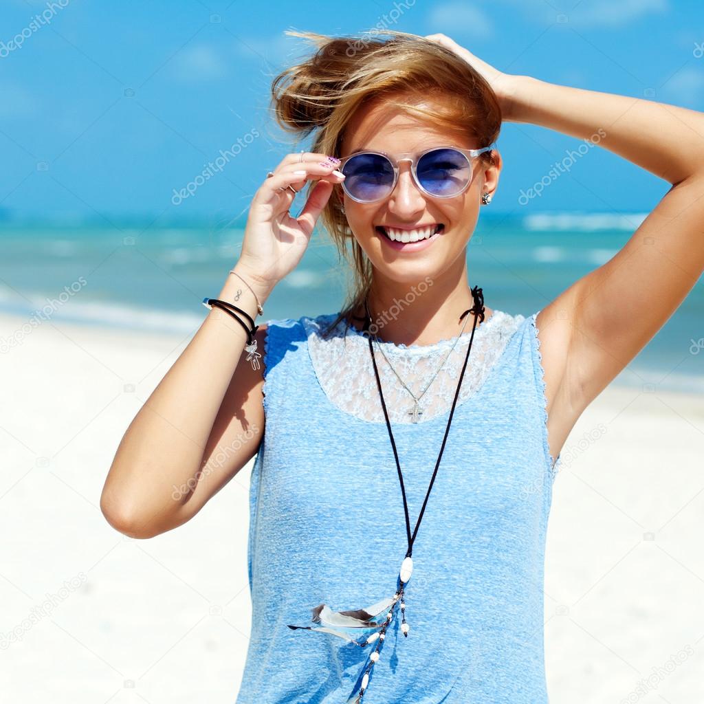 pretty blonde fashion girl on the beach