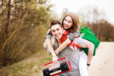 couple with boom box having fun