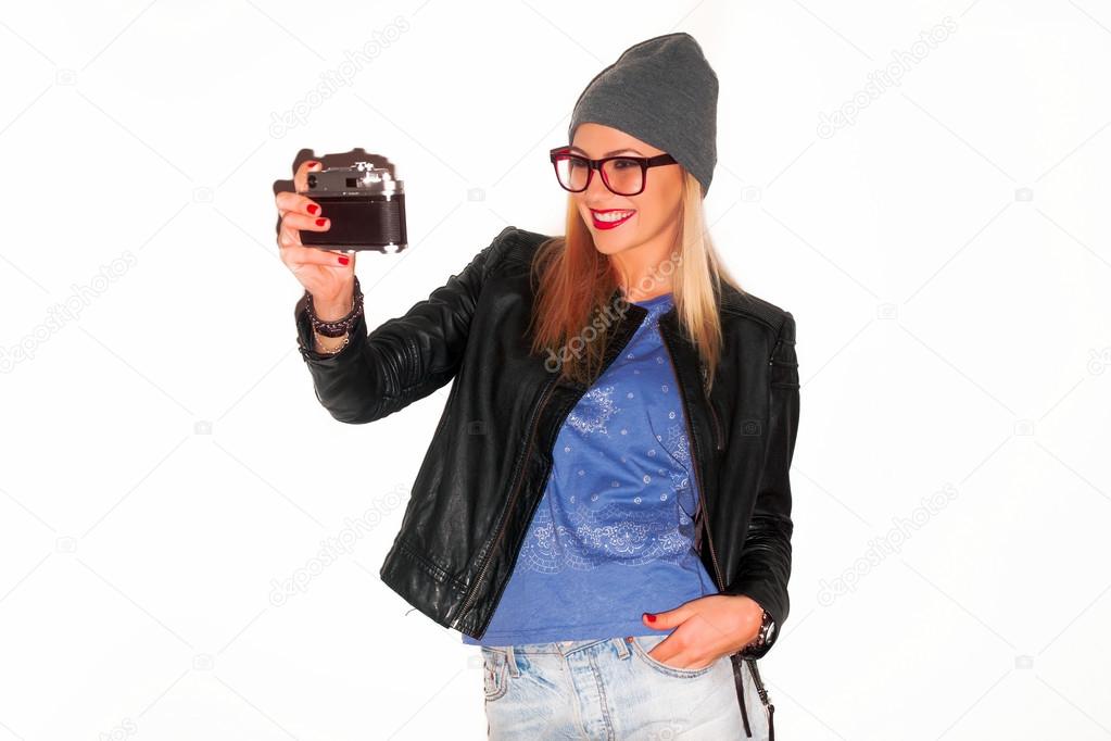 woman making selfie with vintage camera