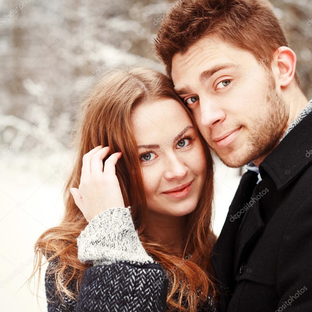 couple in love posing in winter forest