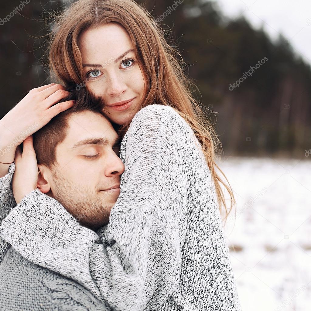 happy couple in love posing in winter