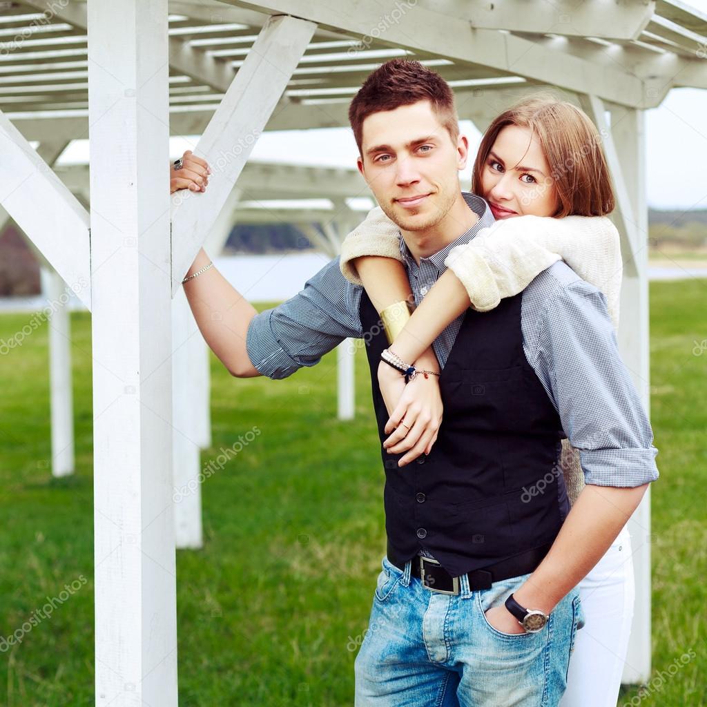 stylish couple posing outdoor in summer