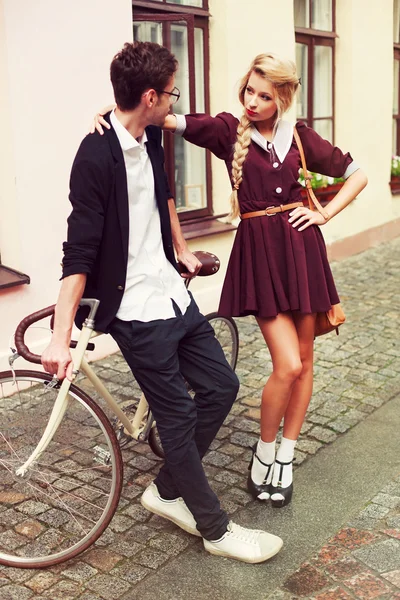 Beautiful hipster couple with bicycle — Stock Photo, Image