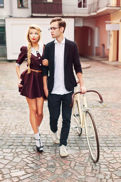 Beautiful hipster couple with bicycle — Stock Photo, Image