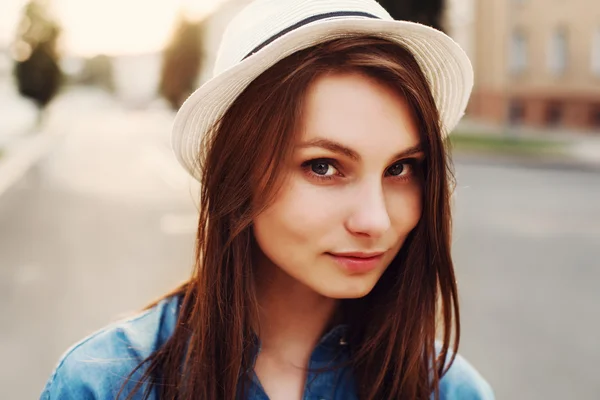 Brunette woman in white hat — Stock Photo, Image