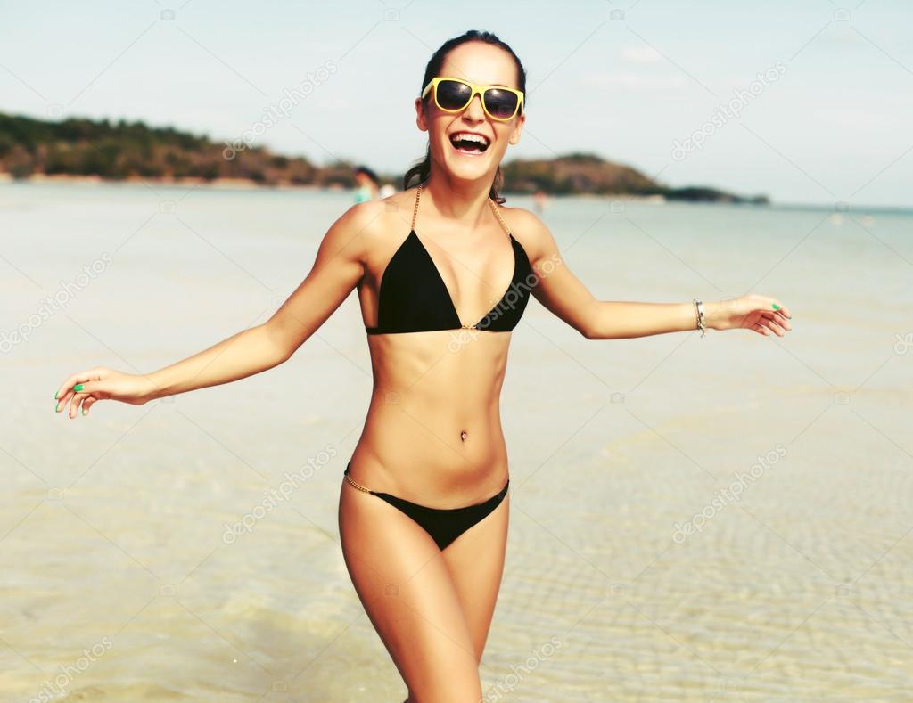 sexy woman having fun on the beach