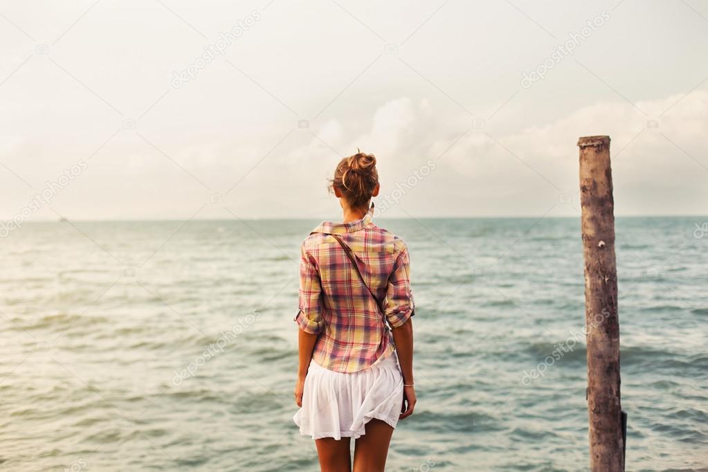 woman posing near the sea