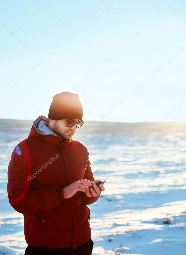 Young handsome man with mobile