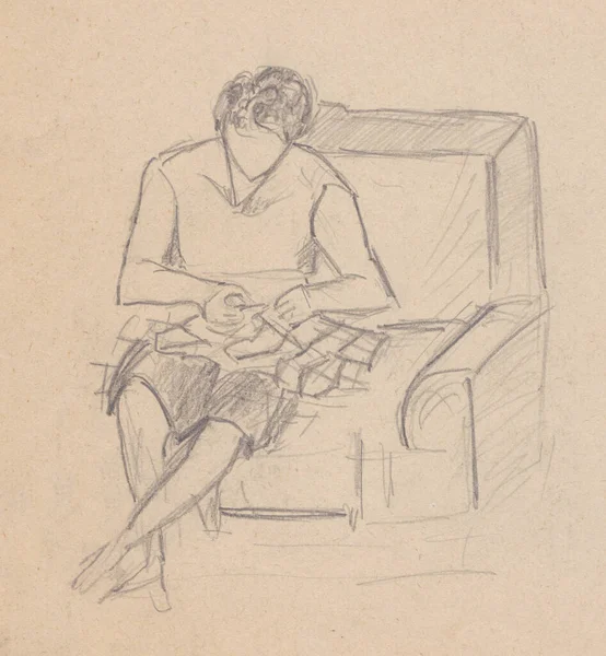 女人坐在沙发上做针线活 — 图库照片