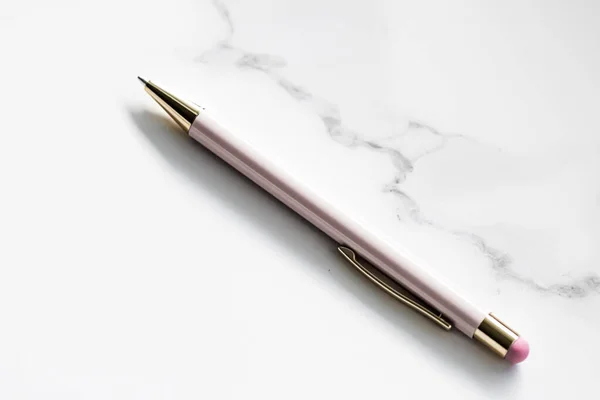 White pen on marble background, luxury stationery and business brand