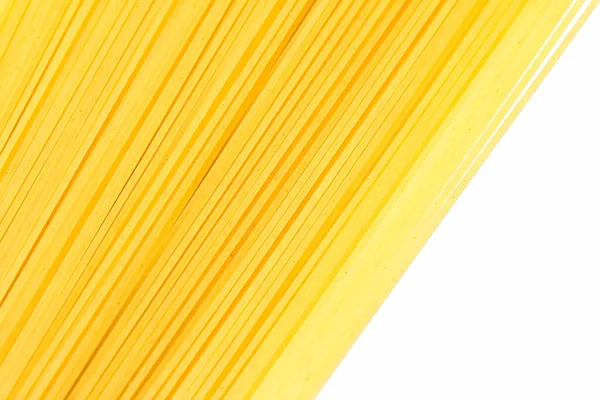 Primer plano de espaguetis de grano entero sin cocer, pasta italiana como ingrediente alimentario orgánico, producto macro y receta de libro de cocina — Foto de Stock