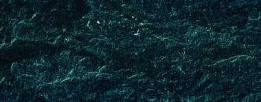 Soyut arkaplan olarak zümrüt yeşil taş dokusu, tasarım malzemesi ve desenli yüzey