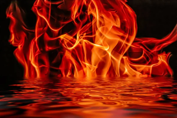 Hot fire flames in water as nature element and abstract background