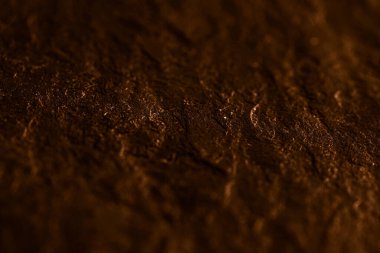 Soyut arkaplan olarak kahverengi taş dokusu, tasarım materyali ve desenli yüzey