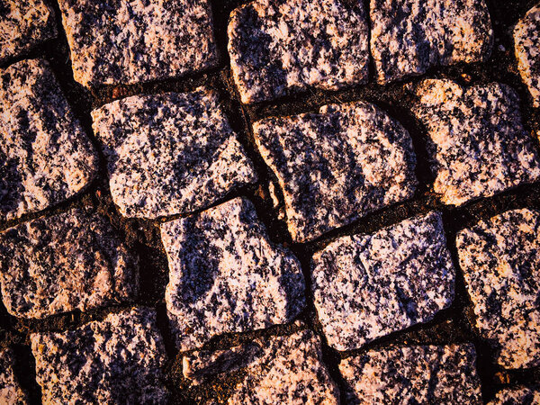 Old rustic stone pavement textured background, architectural detail material and floor surface, abstract natural texture for render, pebble medieval wall