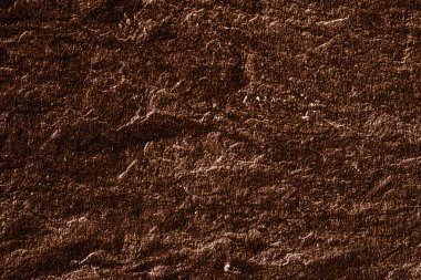 Soyut arkaplan olarak kahverengi taş dokusu, tasarım materyali ve desenli yüzey