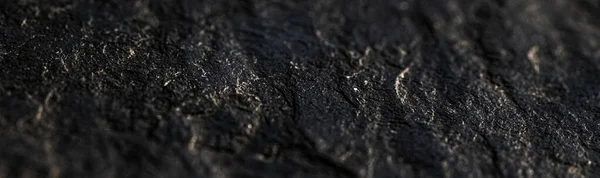 黑石纹理作为抽象背景、设计材料和纹理表面 — 图库照片