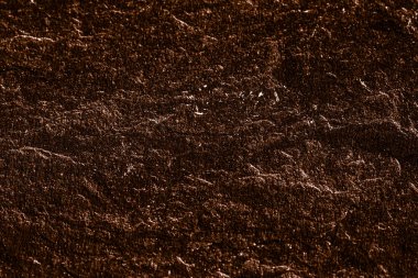 Soyut arkaplan olarak kahverengi taş dokusu, tasarım materyali ve desenli yüzey