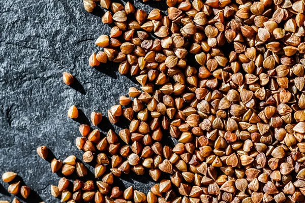 Buckwheat grain closeup, food texture and cook book background — Stock Photo, Image