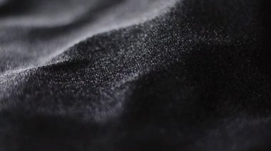 Moda markası için siyah parlak kumaş dokusu. Tatil arkaplanı, tekstil yüzeyi ve lüks malzeme olarak.