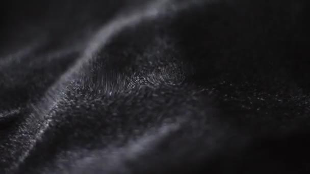 Черный блестящая текстура ткани крупным планом для моды бренда, как праздник блестки фон, текстильная поверхность и роскошный материал — стоковое видео