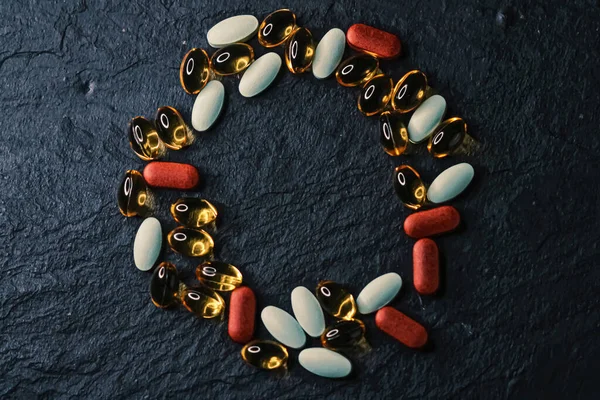 Frame made of medical pills as flatlay background, health and wellness closeup