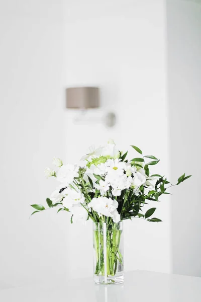 Bouquet of flowers in vase and home decor details, luxury interior design