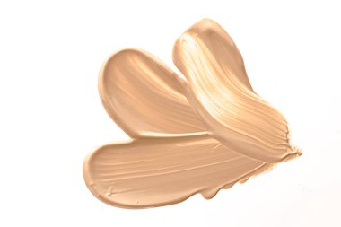 Beyaz arka planda izole edilmiş bej güzellik kozmetik dokusu, lekeli makyaj emülsiyon kremi lekesi veya temel lekesi, ezilmiş kozmetik ürünler ve boya vuruşları