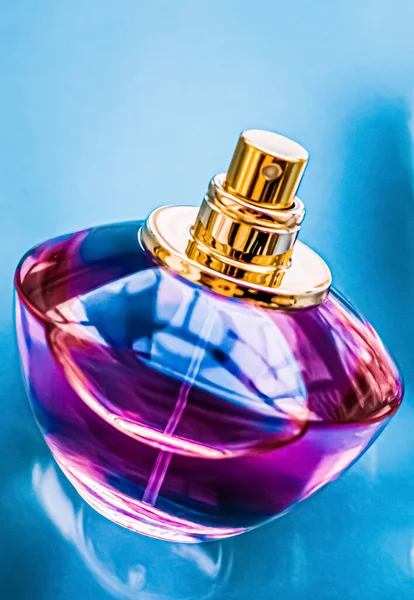 Perfume bottle on glossy background, sweet floral scent, glamour fragrance and eau de parfum as holiday gift and luxury beauty cosmetics brand design
