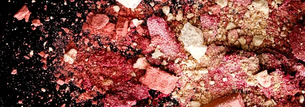 Crushed cosmetics, mineral organic eyeshadow, blush and cosmetic powder isolated on black background, makeup and beauty banner, flatlay design