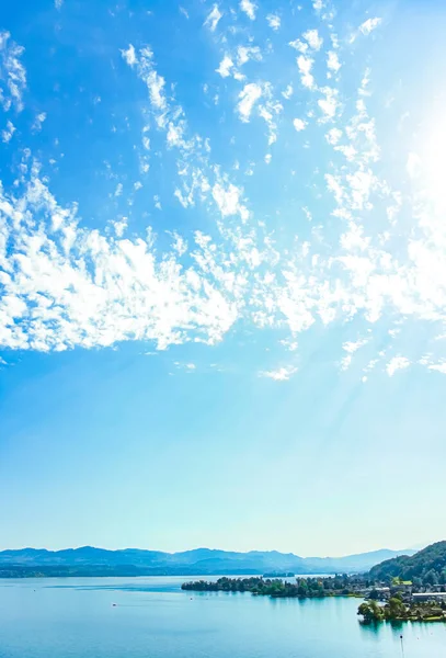 Lake Zurich in Wollerau, canton of Schwyz in Switzerland, Zurichsee, Swiss mountains landscape, blue water and sky in summer, idyllic nature and perfect travel destination, ideal as scenic art print — Stock Photo, Image