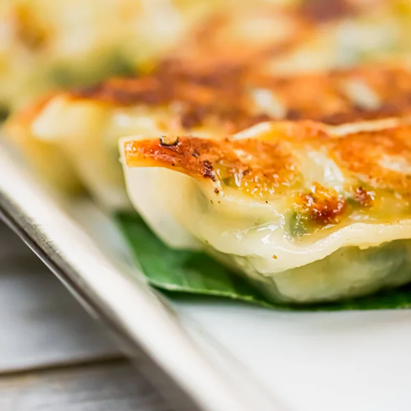 Dumplings with spinach, gyoza served as appetizer on plate in luxury asian restaurant, japanese food and vegetarian menu concept — Stock Photo, Image