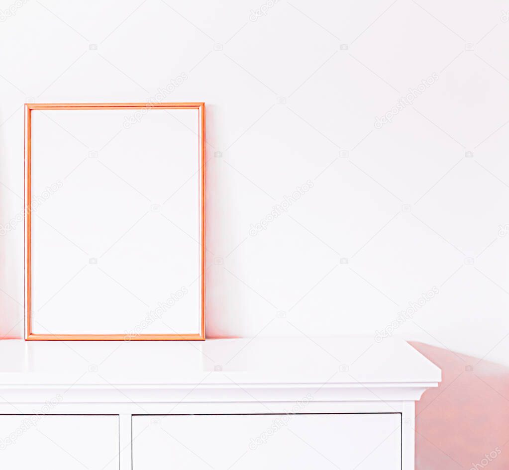 Rose gold frame on white furniture, luxury home decor and design for mockup, poster print and printable art, online shop showcase
