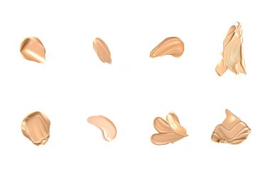 Beyaz arka planda izole edilmiş bej güzellik kozmetik dokusu, lekeli makyaj emülsiyon kremi lekesi veya temel lekesi, ezilmiş kozmetik ürünler ve boya vuruşları