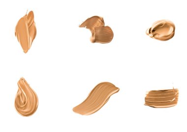 Beyaz arka plan, güzellik ve kozmetik üzerinde izole makyaj dokusu olarak sıvı temel lekeleri, lekeler, lekeler ve felçler