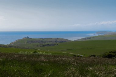 Beachy Head lighthouse standing on a chalk cliff, guarding the English Channel coast. East Sussex countryside, England