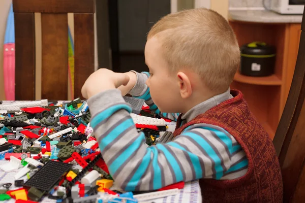 Boy plays with constructor — Stock Photo, Image