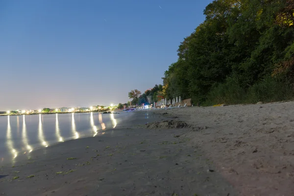 Night beach umbrellas — Stock Photo, Image