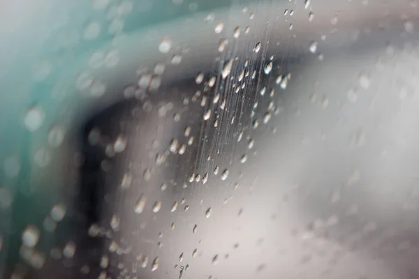 Rain drops on automobile glass — Stock Photo, Image