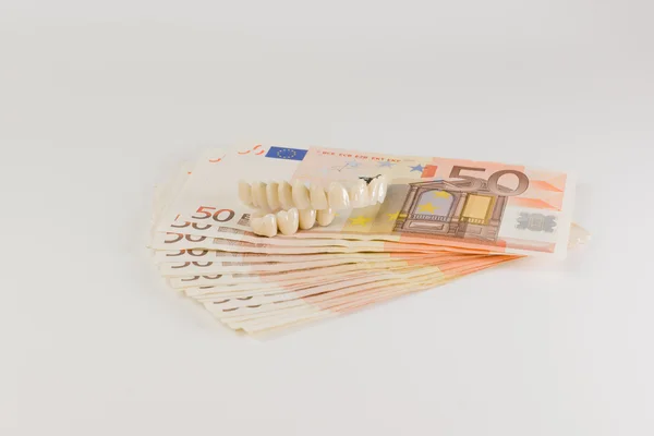 Dentures and cash — Stock Photo, Image