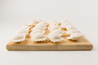 frozen a dumplings on a board