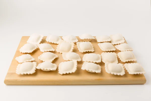Frozen a dumplings on a board — Stockfoto