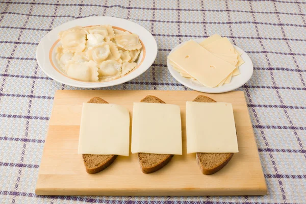 Hot lunch with boiled a dumplings in an environment of bread of — Stock Photo, Image