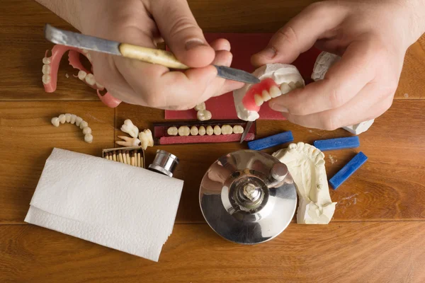 Place of work of the dental technician with hands — Stock Photo, Image