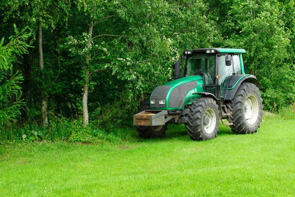 Tractor in the wood — Stock Photo, Image