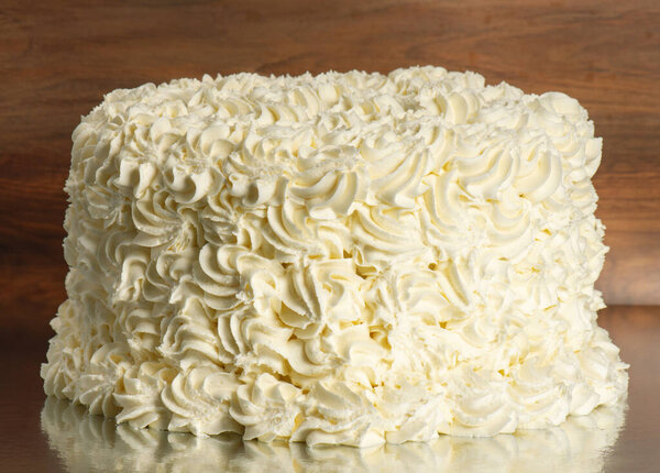 Classic rosette icing sponge cake. Detailed food background.