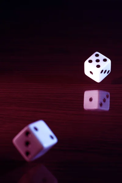 Gaming dice with a red tint. — Stock Photo, Image