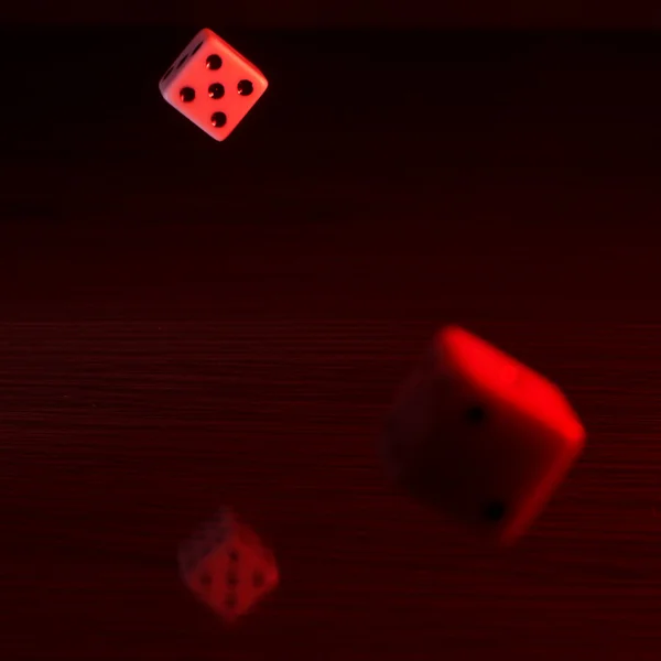 Gaming dice with a red tint. — Stock Photo, Image