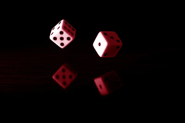 Gaming dice with a red tint. — Stock Photo, Image