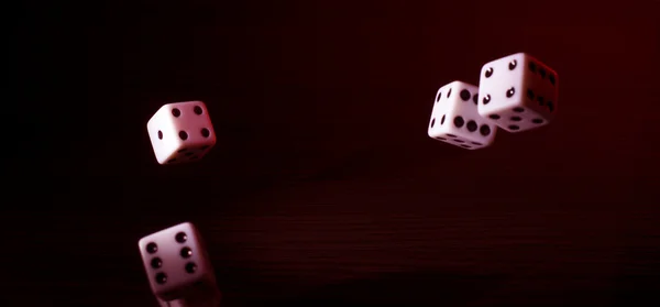 Gaming dice with a red tint. — Stock Photo, Image